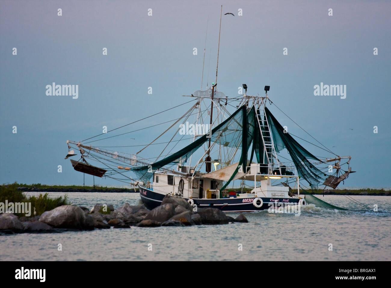 Shrimp trawler in Cameron, Louisiana heading out to sea Stock Photo Alamy
