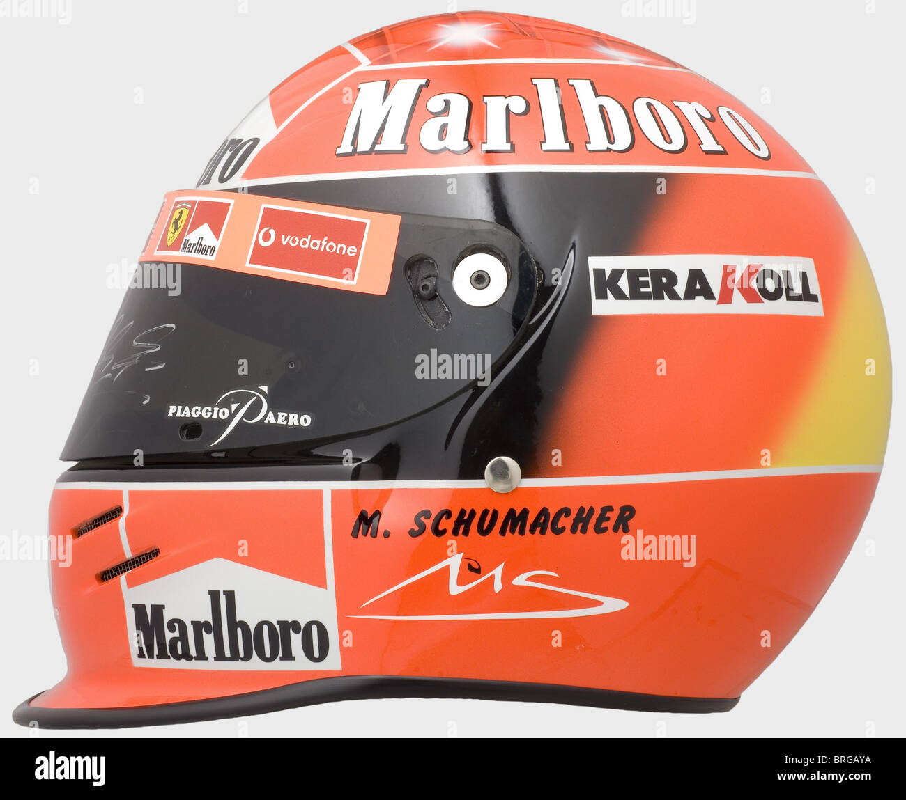 Michael Schumacher,a racing helmet of the seven-time Formula 1 world  champion,2002 season The visor with signs of use,handsigned by Michael  Schumacher.Authentically produced in limited quantity,this authorised  replica bears a special airbrush painting