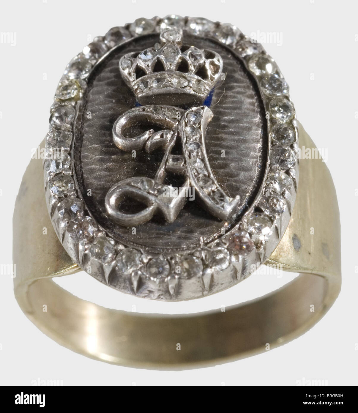 Prince Alfons of Bavaria(1862 - 1933),a monogrammed presentation ring Finger ring,gold,marked '333',face with oval silver medallion,engraved enamel background,imposed the crowned letter 'A' formed by 19 old cut diamonds. Edge of the medallion studded with 30 old cut diamonds. Medallion 19 x 14.5 cm. Ring diameter ca. 18 mm.,historic,historical,19th century,Bavaria,Bavarian,German,Germany,Southern Germany,the South of Germany,object,objects,stills,militaria,clipping,cut out,cut-out,cut-outs,fine arts,art,art object,art objects,artful,Additional-Rights-Clearences-Not Available Stock Photo