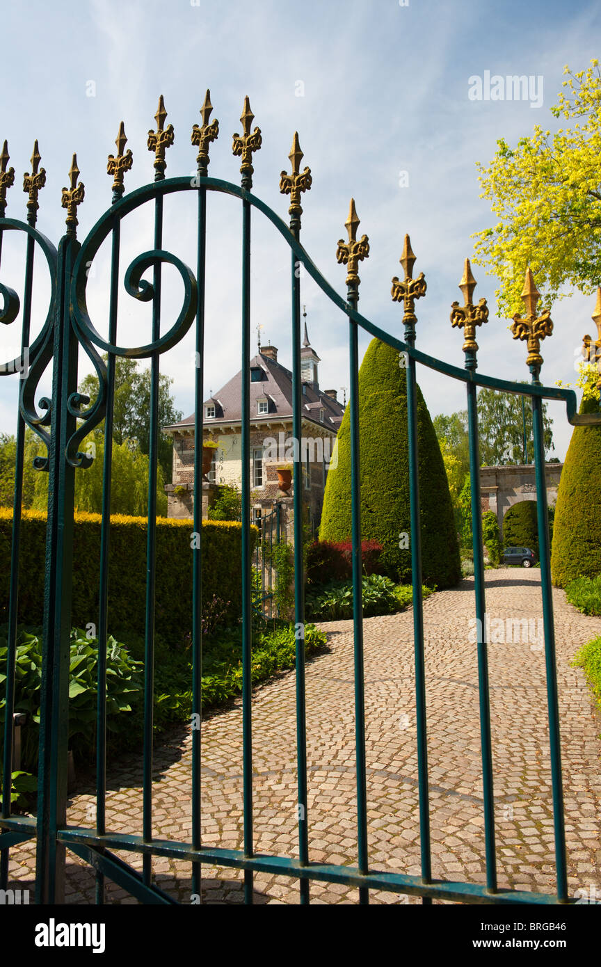 Dutch castle Wijlre and garden with closed fence  Stock Photo
