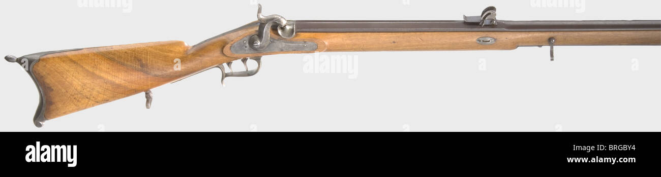 A percussion sniper rifle Wild system.,Two-stage browned barrel,octagonal turning into round,5-groove rifling in calibre 10.5 mm,iron front sight and bayonet stud at the side. In central barrel position Hessian quadrant sight with engraved scale 200 - 1000 paces. Percussion lock with Hessian acceptance marks: crown,crowned 'L','18' and master's monogram 'AB'. German set trigger. Light walnut stock with iron furniture,crown stamp on trigger guard,'18' on nose,'L' and 'SL' on stock. Length 127.5 cm. Armoury condition. Unknown model,presumably test rifle,Additional-Rights-Clearences-Not Available Stock Photo