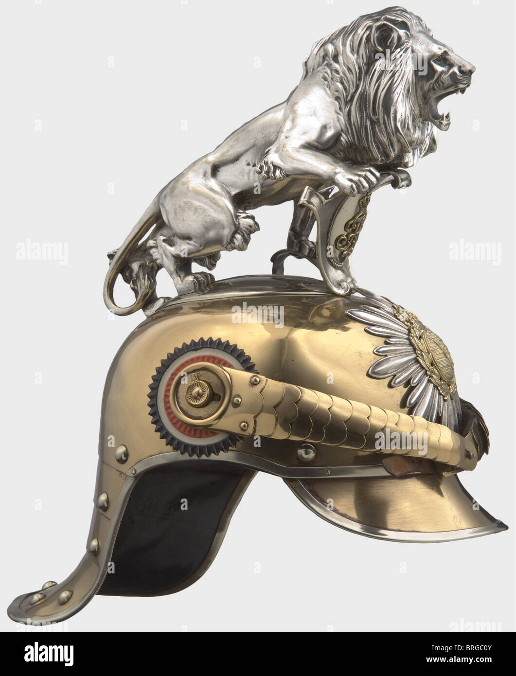 A model 1889/1907 helmet for enlisted men,of the Royal Saxon Gardereiter-Regiment Tombac skull,silver-plated star with superimposed coat of arms,convex metal chinscales on '91' button.Enlisted personnel cockades.Inside the maker's name 'G.H.Osang Dresden 1915',size '55',on top item number '34'.Black leather lining.The rear peak is covered with black leather,the front peak painted green on the inside.Silver-plated parade lion above the cipher shield.Rare helmet in beautiful condition,traces of mechanical cleaning on skull and lion.,historic,histo,Additional-Rights-Clearences-Not Available Stock Photo