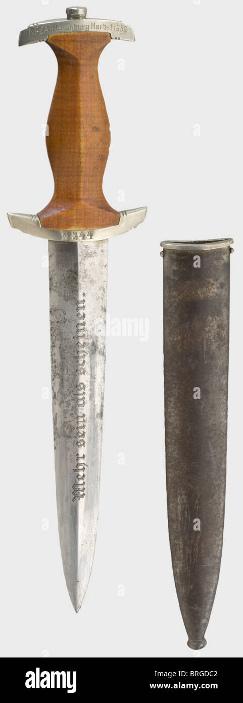 A dagger,for a Napola(National Political Academy)pupil Blade(stained)with etched motto,and manufacturer's inscription 'Karl Burgsmüller Berlin-Charlottenburg 5'. Brown wooden grip. Nickel-silver quillons,inscribed 'N 244',the pommel with 'NPEA Naumburg Herbst(Fall)1939'. Iron scabbard(lightly rusted)with remnants of bluing. Length 34.5 cm.,historic,historical,1930s,20th century,League of German Girls,Band of German Maidens,youth organization,youth organizations,NS,National Socialism,Nazism,Third Reich,German Reich,Germany,National Soc,Additional-Rights-Clearences-Not Available Stock Photo