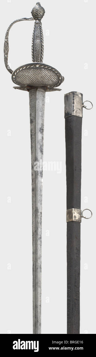 A silver-mounted French smallsword,circa 1780 Triangular fluted thrusting blade with etched ornamentation at the base of the blade. Silver knucklebow hilt with a diamond polished,openwork diamond-shaped web pattern,set in corded strip edging. Unclear crowned silver hallmark. Leather scabbard with silver mountings. Length 93 cm.,historic,historical,18th century,sword,swords,weapons,arms,weapon,arm,fighting device,military,militaria,object,objects,stills,clipping,clippings,cut out,cut-out,cut-outs,melee weapon,melee weapons,metal,Additional-Rights-Clearences-Not Available Stock Photo