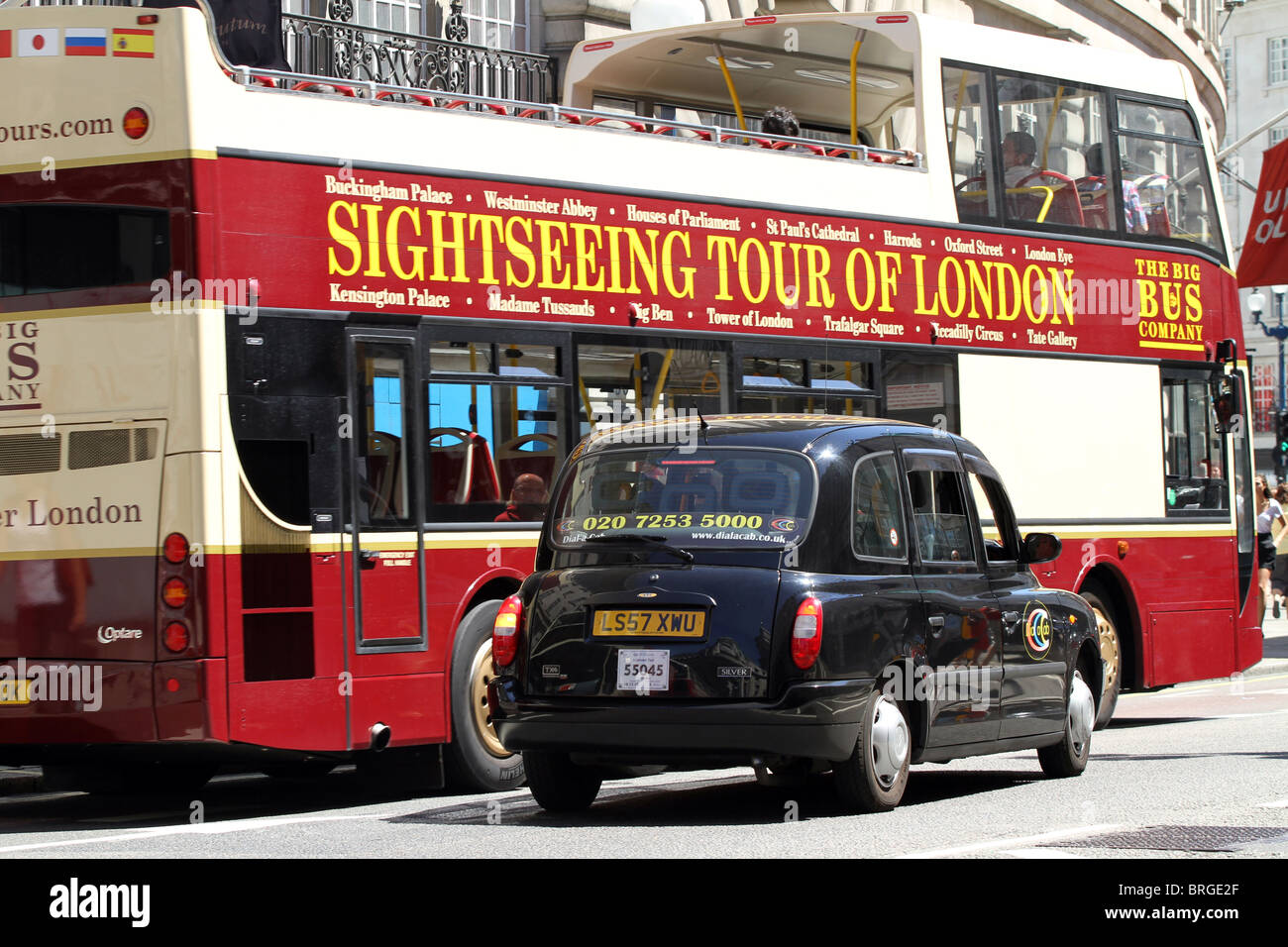 Black London taxi cab and tourist sightseeing tour bus for tourism, London, England Stock Photo