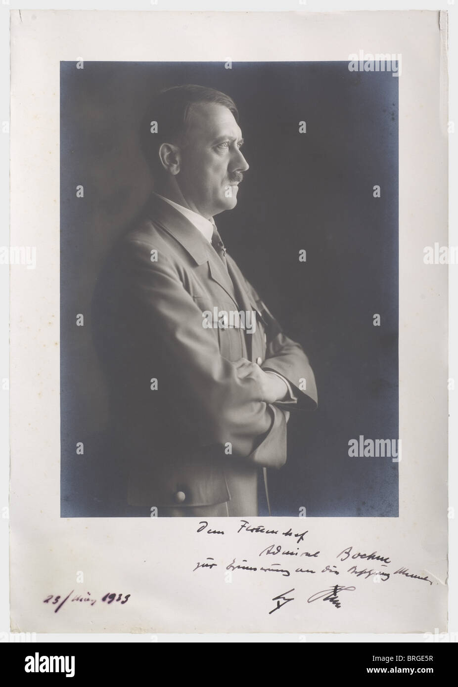 Admiral Hermann Boehm (1884 - 1972), an official presentation photograph of Adolf Hitler 1939 A large format Hoffmann portrait photo, showing Hitler in profile in party uniform. There is an autograph dedication by Hitler on the passepartout, 'Dem Flottenchef Admiral Boehm zur Erinnerung an die Besetzung Memels - Adolf Hitler' (To Fleet Commander Admiral Boehm in Commemoration of the Occupation of Memels - Adolf Hitler) along with the date '23/März 1939'. Hermann Boehm, was among other things, a torpedo boat commander in the First World War. Discharged as a lieu, Stock Photo