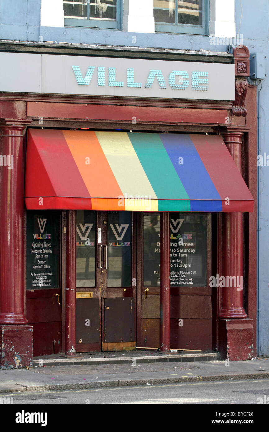 The Village Bar with rainbow awning in Old Compton Street, gay village in Soho, London, England Stock Photo