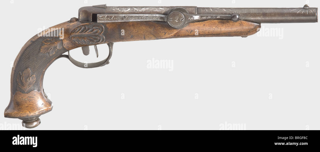 A Dreyse needle-fire front-loading pistol no.2,circa 1828.Round iron barrel,staged in the middle with the step decorated by a corded ring just like the muzzle.Smooth bore in calibre 14 mm.Iron front sight on disk.Almost the complete barrel surface and muzzle in vine engravings,flashes of lightning and rays in silver inlay,in front half marked 'N.Dreysens Patentierte Zündnadel Pistole'.The cocking mechanism on the side labelled 'Fabrick von Dreyse und Collenbusch in Soemmerda',in the middle serial no.'2'.Carved walnut stock with checkered grip and l,Additional-Rights-Clearences-Not Available Stock Photo