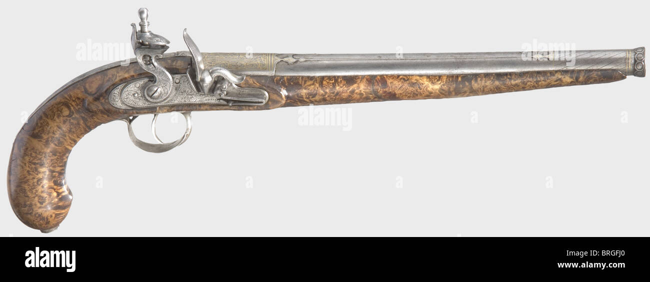 A Persian flintlock pistol,circa 1810 Round,smooth bore Damascus barrel in 14 mm calibre with a cannon muzzle.The top of the barrel is cut with arabesque decoration and is stamped with an Arabic master's mark.Gold-inlaid ornamentation above the chamber.English flintlock with fine floral engraving and a waterproof pan.Frizzen with roller.Signed 'W.Parr' in front of the frizzen spring.Beautifully figured wooden full stock with iron trigger guard.Length 44 cm.William Parr,Birmingham and Liverpool,known 1799 - 1810,called himself an 'African gun maker,Additional-Rights-Clearences-Not Available Stock Photo