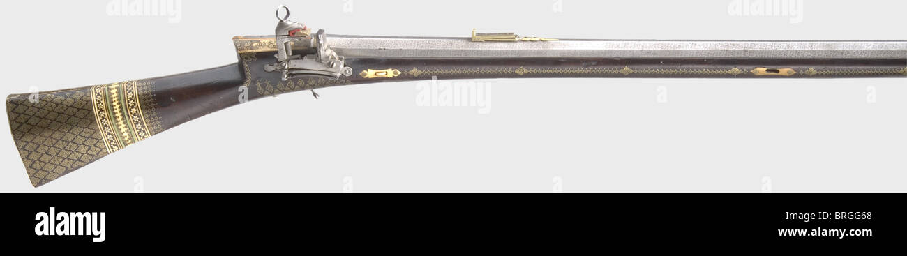 An Ottoman miquelet flintlock rifle,2nd half of the 18th century  Heavy,lightly swamped rose Damascus barrel with eight groove rifled bore in  15 mm calibre with a folding,triple aperture rear sight(front sight  missing).