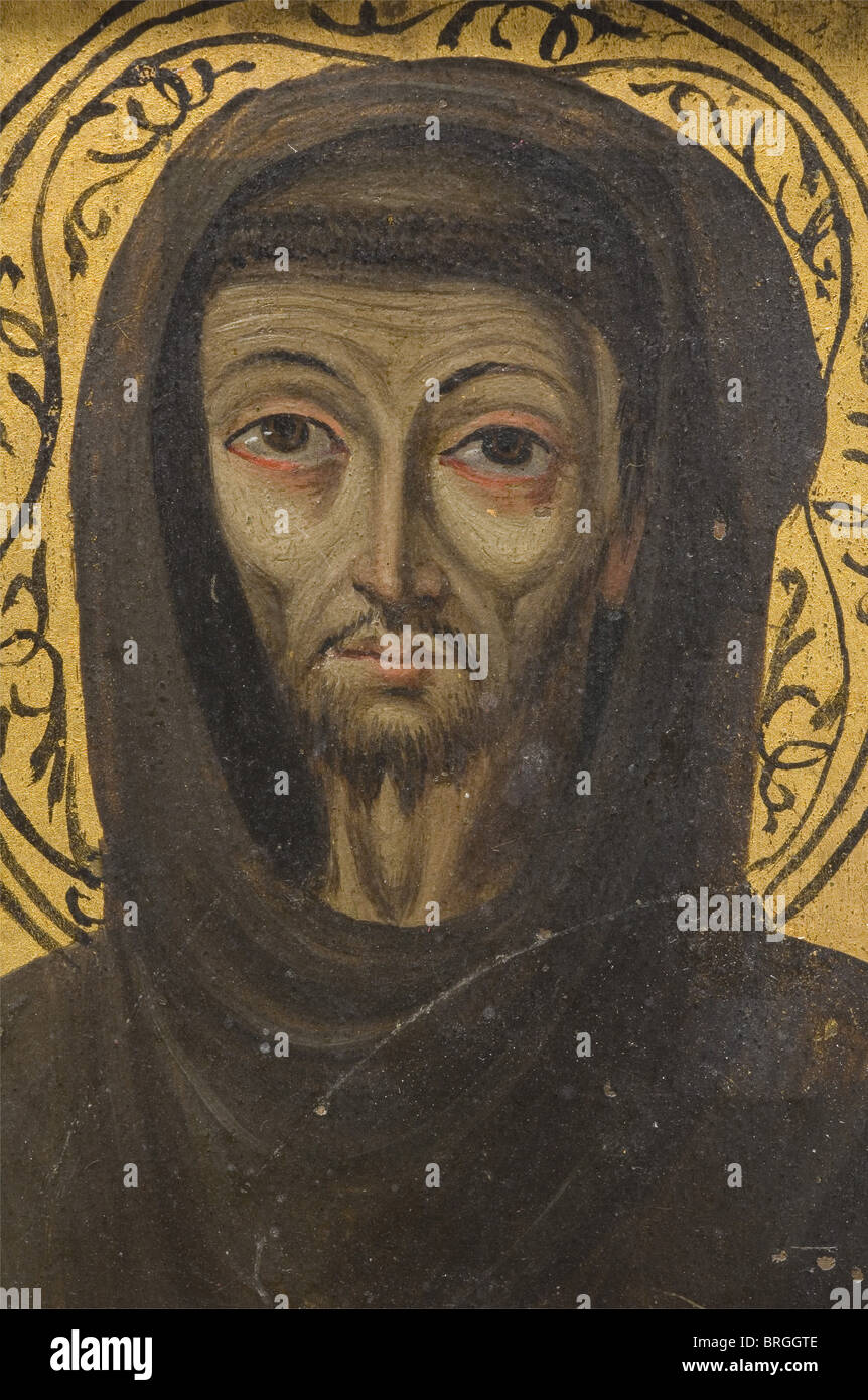 A French miniature painting of St. Francis, 2nd half of the 15th century Oil on gilded copper. A half portrait of the saint with a finely drawn impressive face in a brown cowl. He is holding a book with the inscription 'V-S F-E' in his left hand, the right is raised in admonition. Stigmata on both hands. In a silver frame provided with a small loop for hanging. Dimensions 9 x 7 cm. Francis of Assisi (1181/82 - 1226), founder of the Franciscan Order, was declared a saint in 1228 by Pope Gregory IX., people, 15th century, handicrafts, handcraft, craft, object, ob, Stock Photo