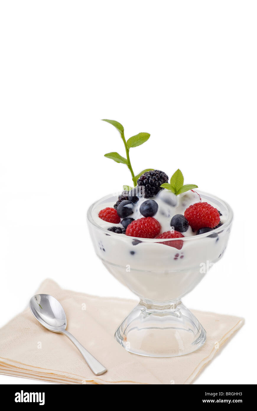 Fresh assorted summer berries in natural yogurt. Stock Photo