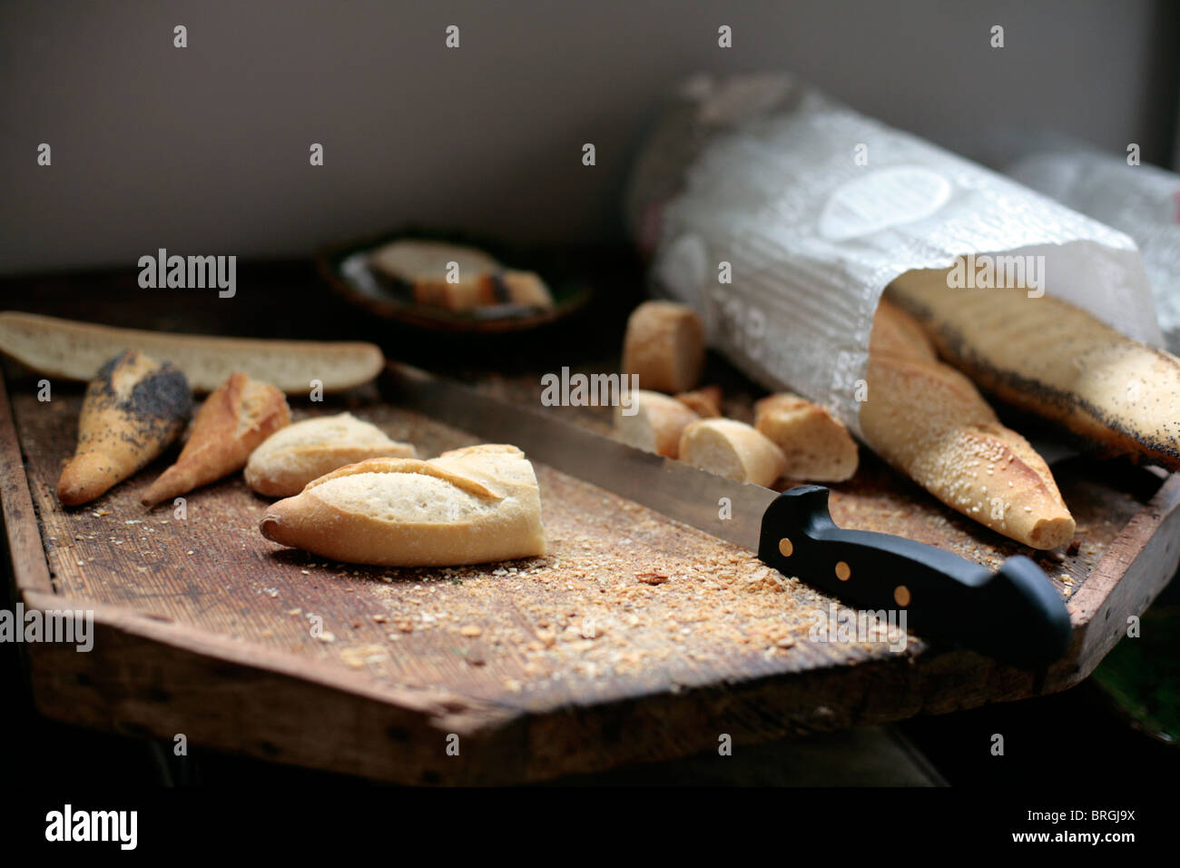 French bread on a chopping board in a restaurant, France. Stock Photo