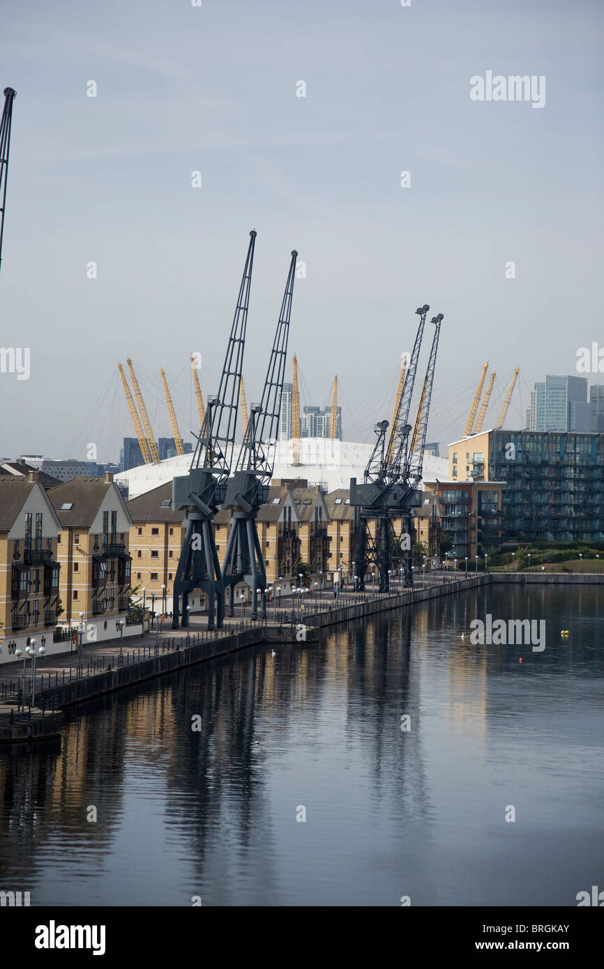 Royal Victoria Dock in London Docklands with warehouse apartments and O2 arena in the background, Stock Photo