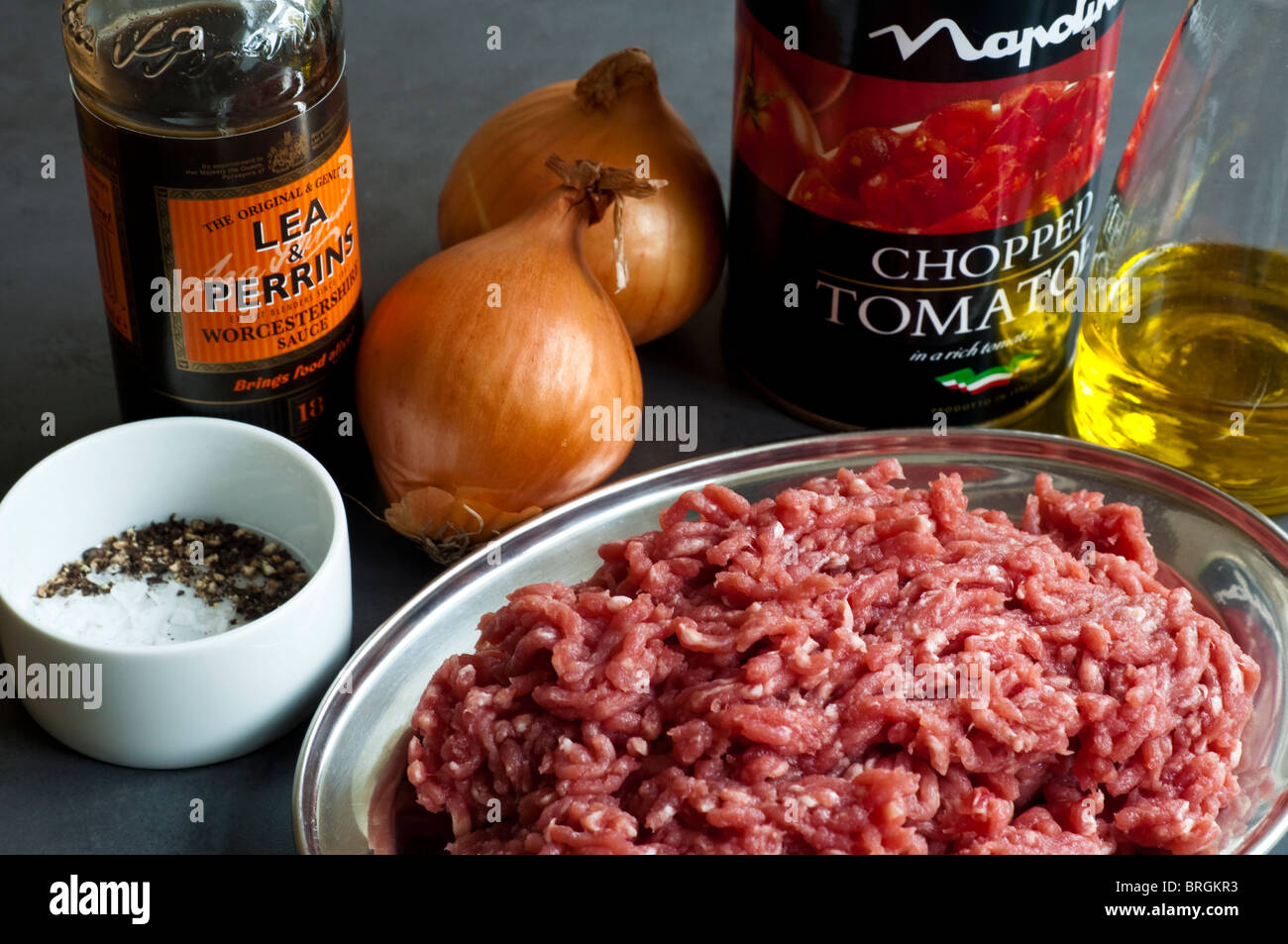 The basic ingredients to make a Bolognese meat sauce; showing, raw