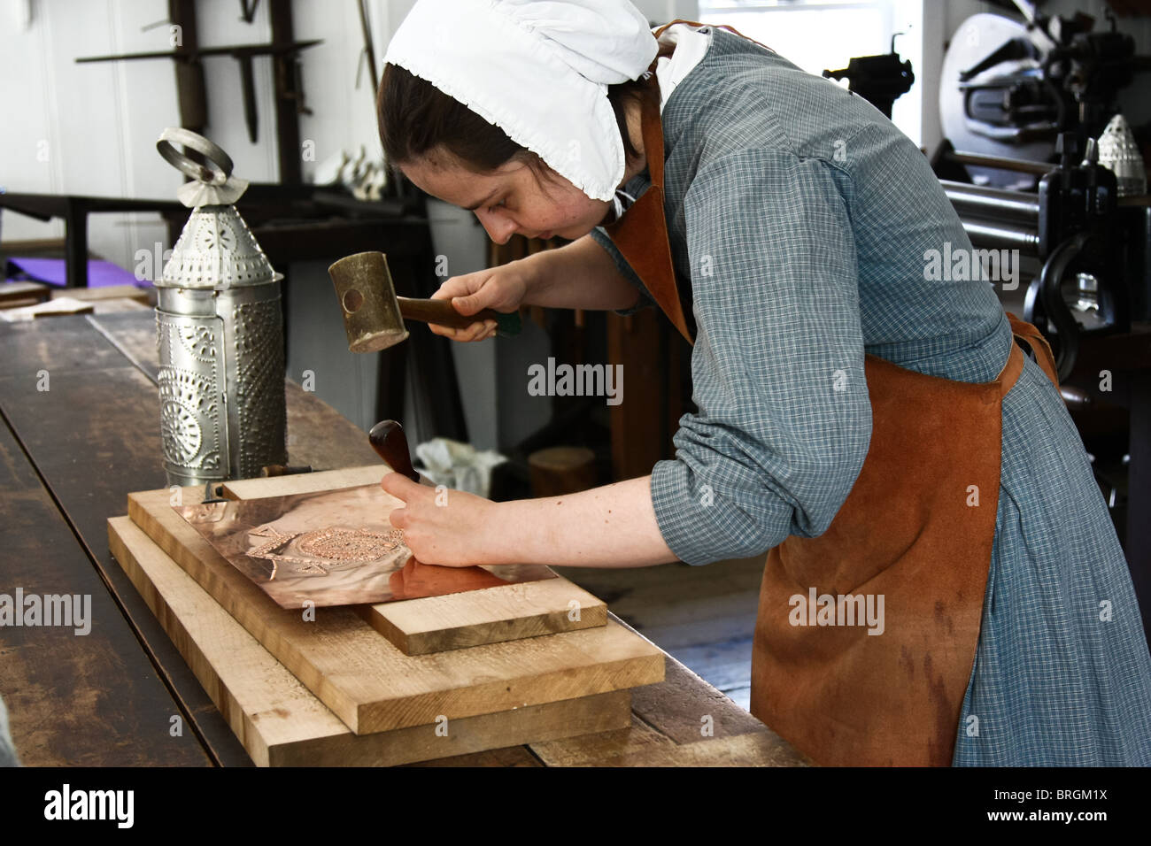female tinker tinplate worker Stock Photo