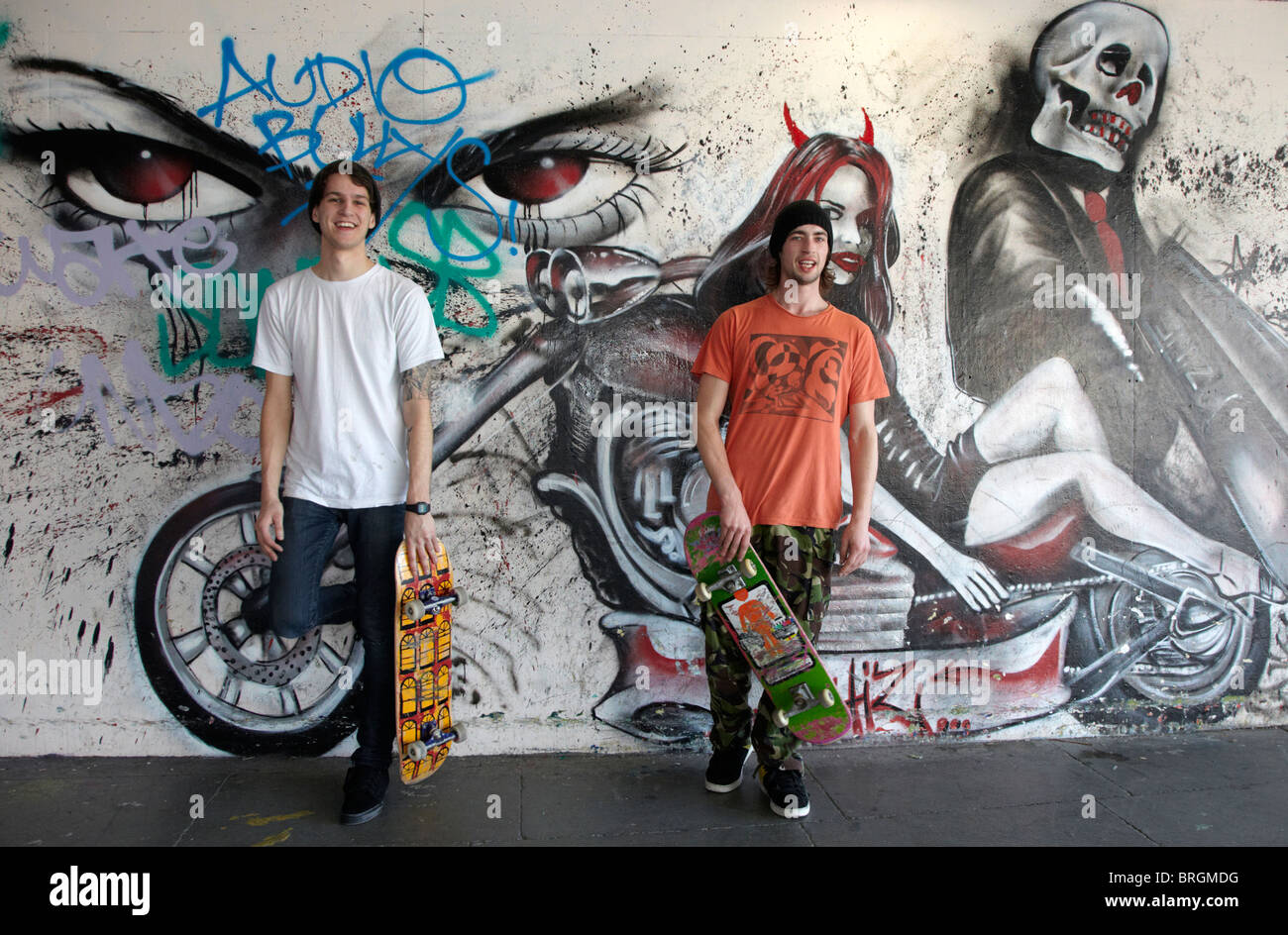 Devil Woman Graffiti With Two Male Skateboarder South Bank London UK Europe Stock Photo