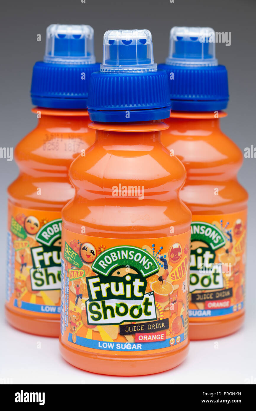 Three plastic bottles of Robinson's Fruit Shoot orange juice drink made from concentrate Stock Photo