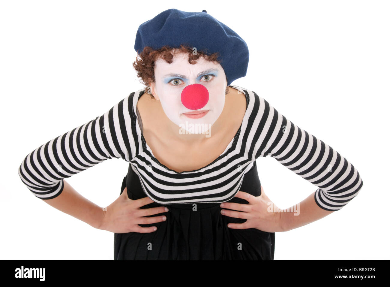 young woman wearing clown face bending over and looking at camera Stock Photo