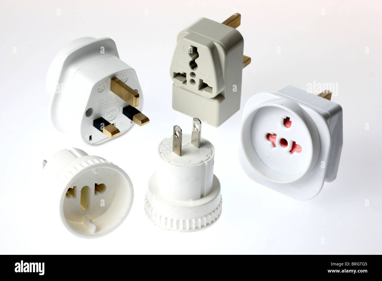 Power adapter plug and socket, for connecting different electrical systems. Travel equipment. Stock Photo