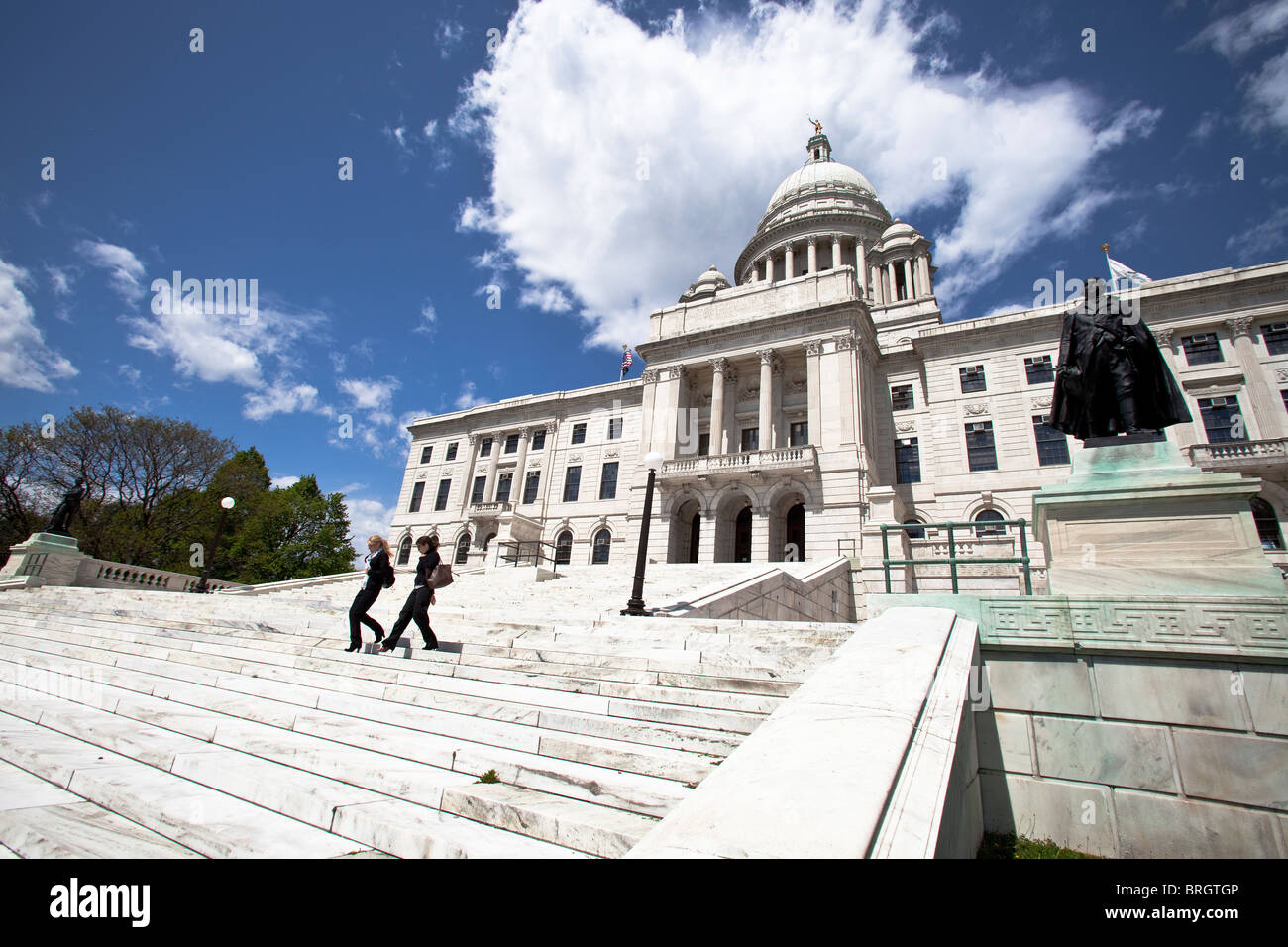Two People Walking Down the Steps at the Rhode Island State Capitol Stock Photo