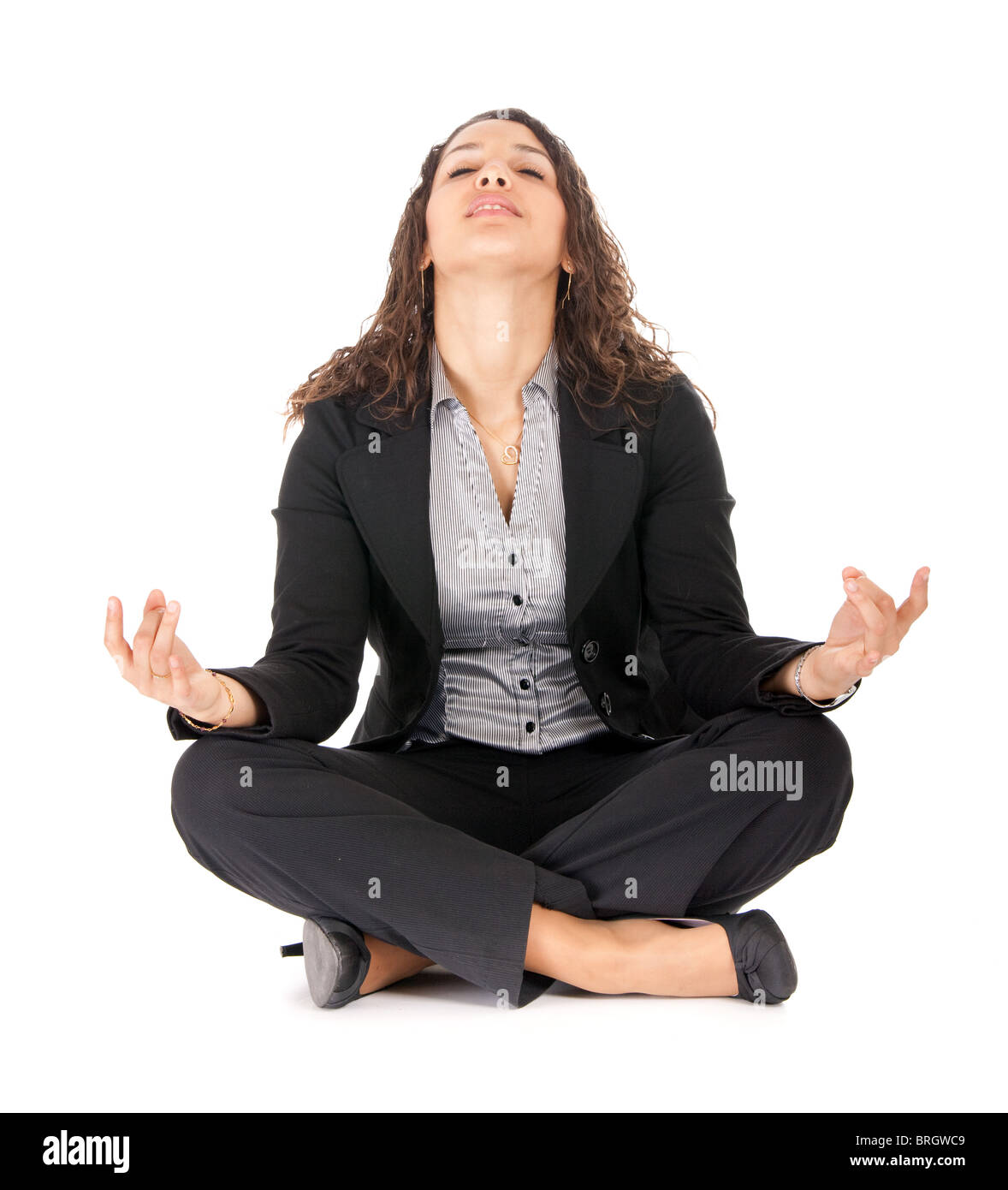 young business woman in yoga position taking a breath Stock Photo