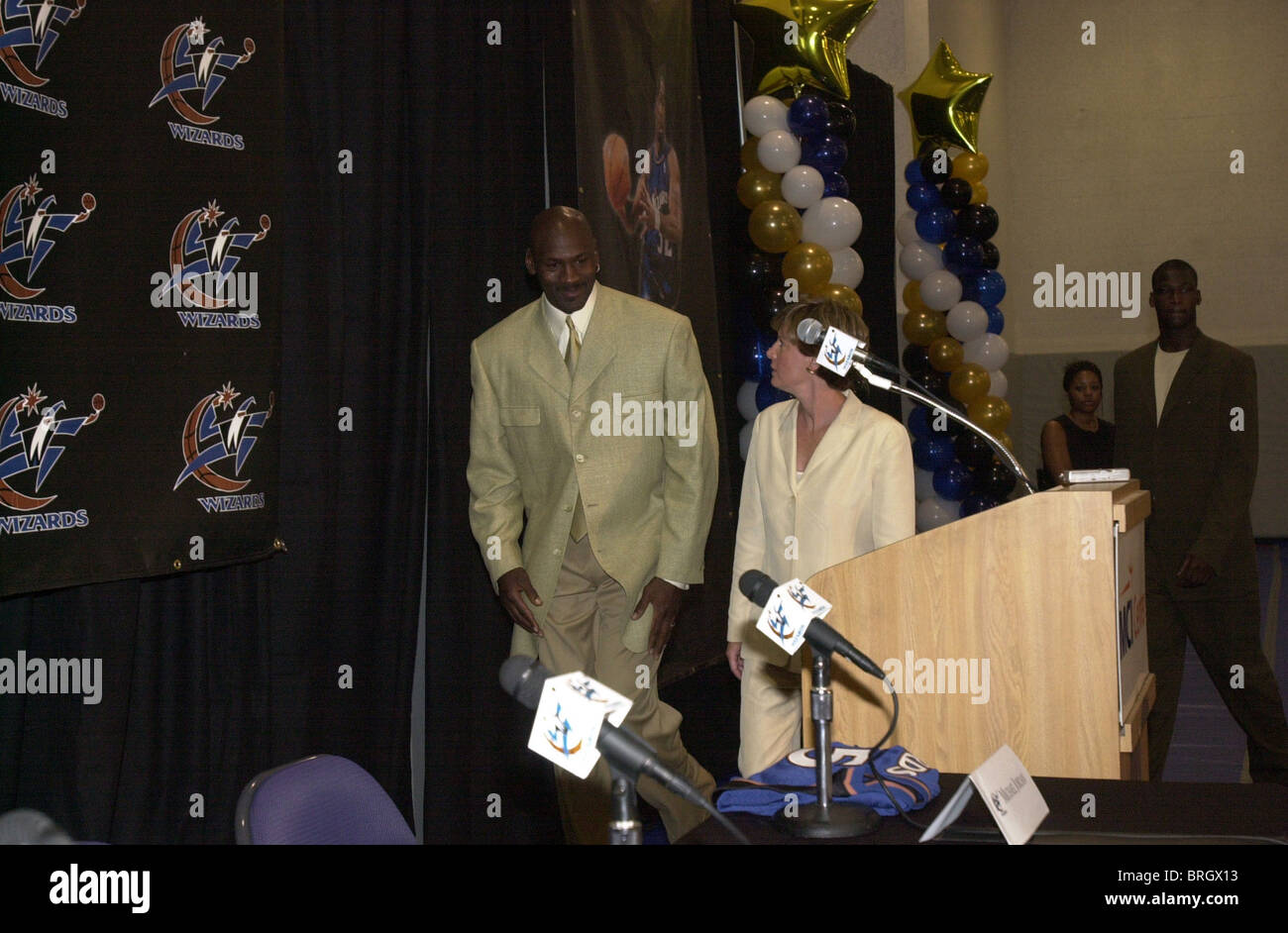 Michael Jordan and Kuame Brown speak at a news conference. Stock Photo