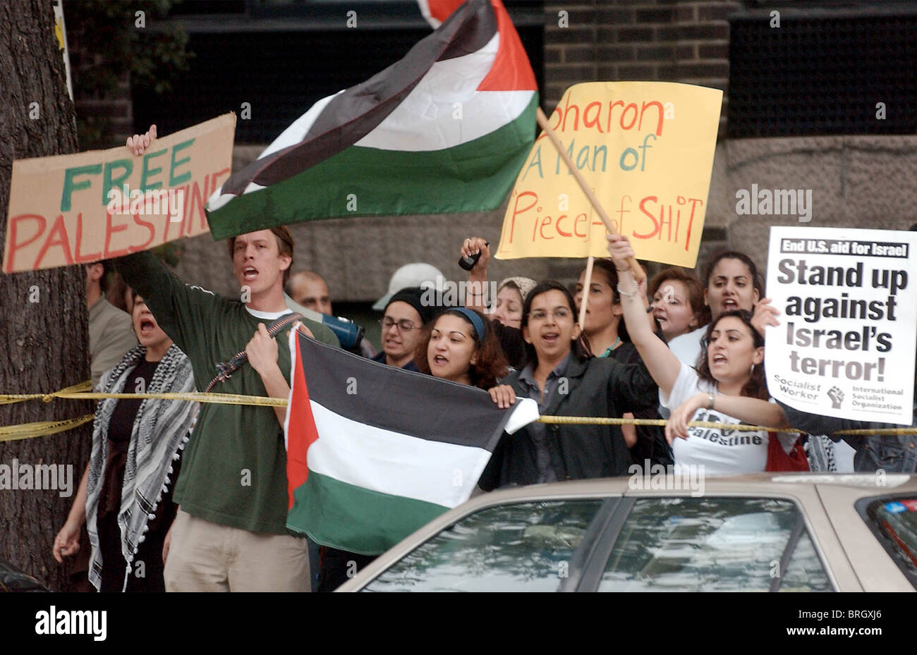 Protesters gather outside the hotel where Prime Minister of Israel, Ariel Sharon speaks in Washington . Stock Photo