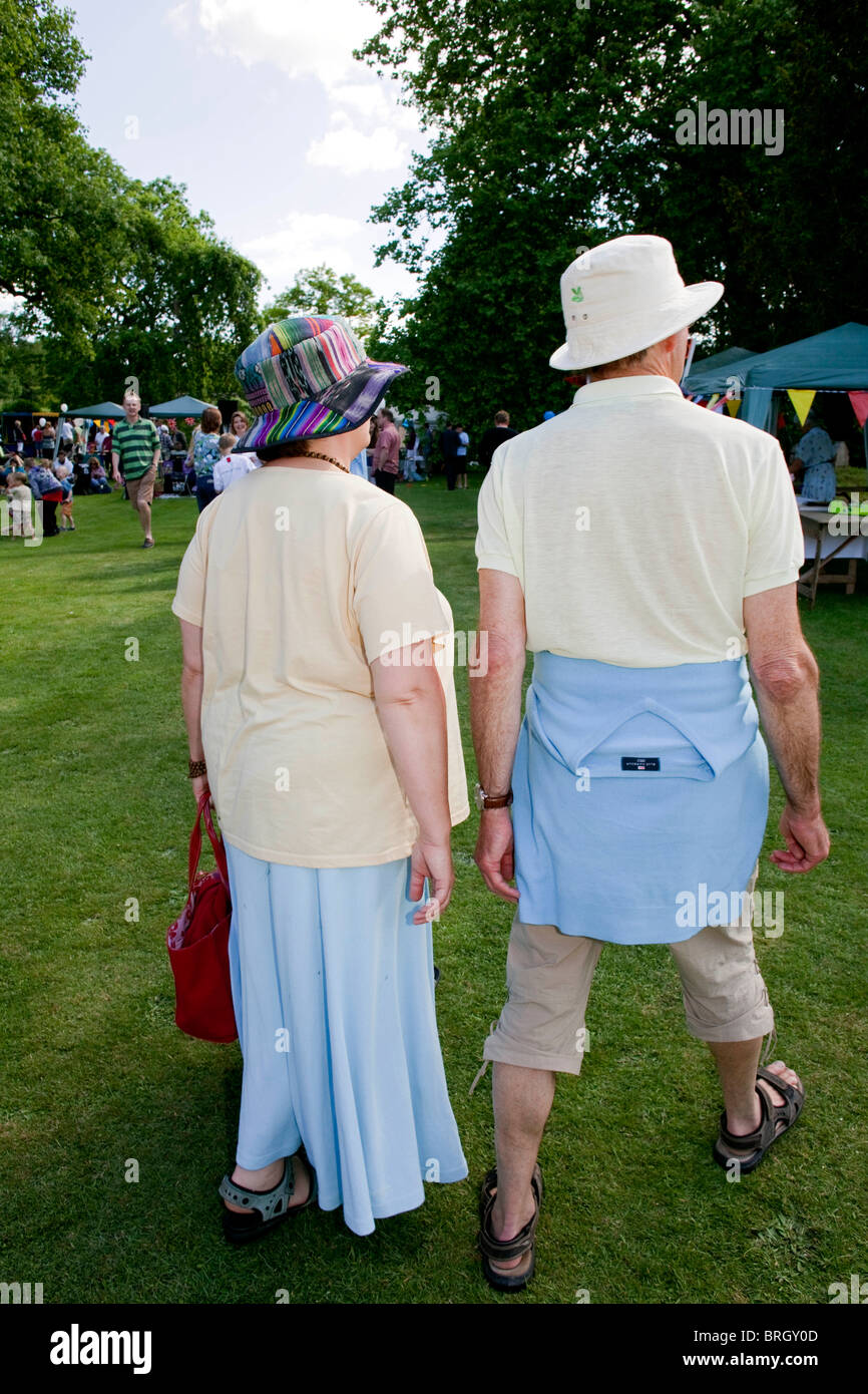 A couple wearing sun hats at the annual summer Charminster Fete, in the