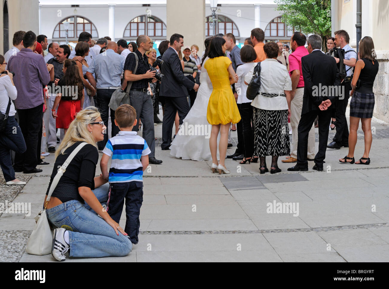 Wedding guests outside church hi-res stock photography and images - Alamy