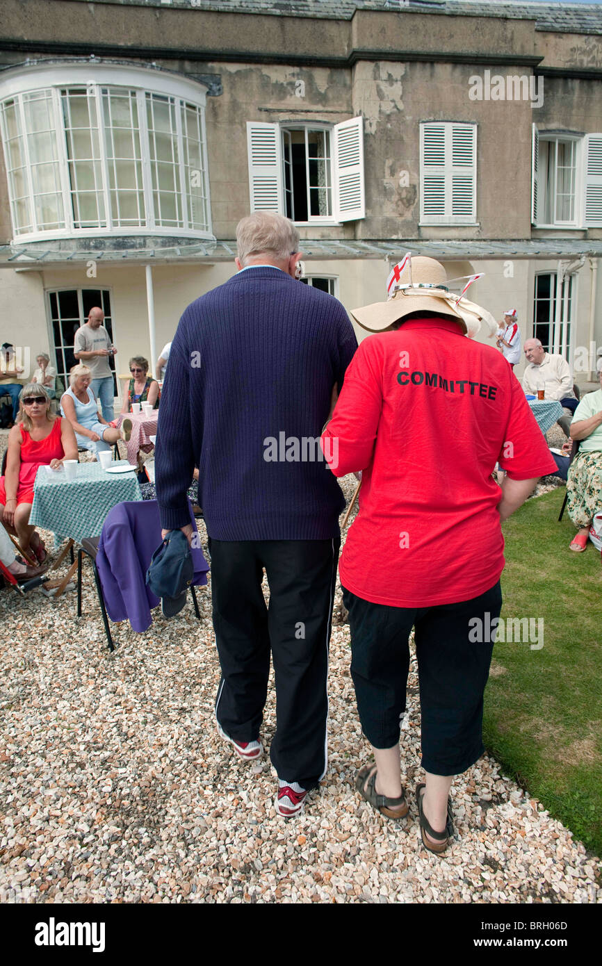 A retired elderly couple, at the annual summer Charminster Fete, in the