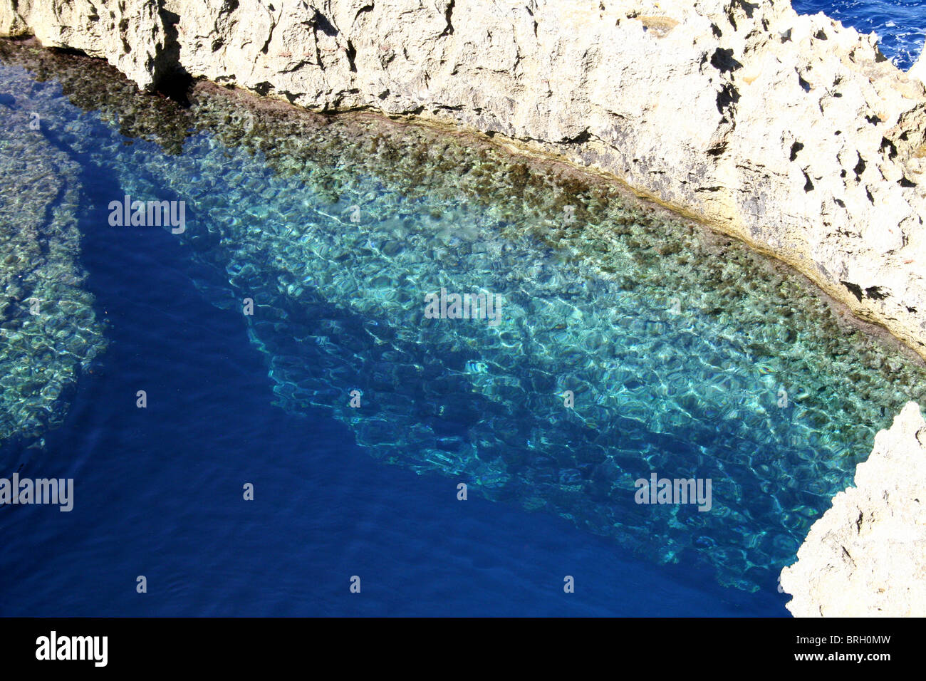 a deep pool with shelf next to the azure window in Gozo off Malta Stock Photo