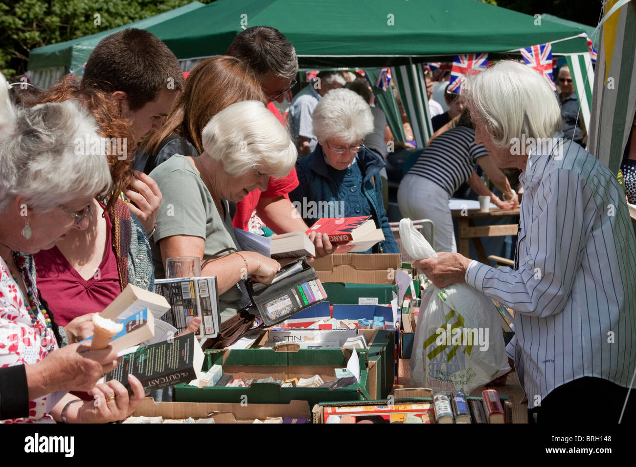 Buying second hand books at the annual summer Charminster Fete, in the