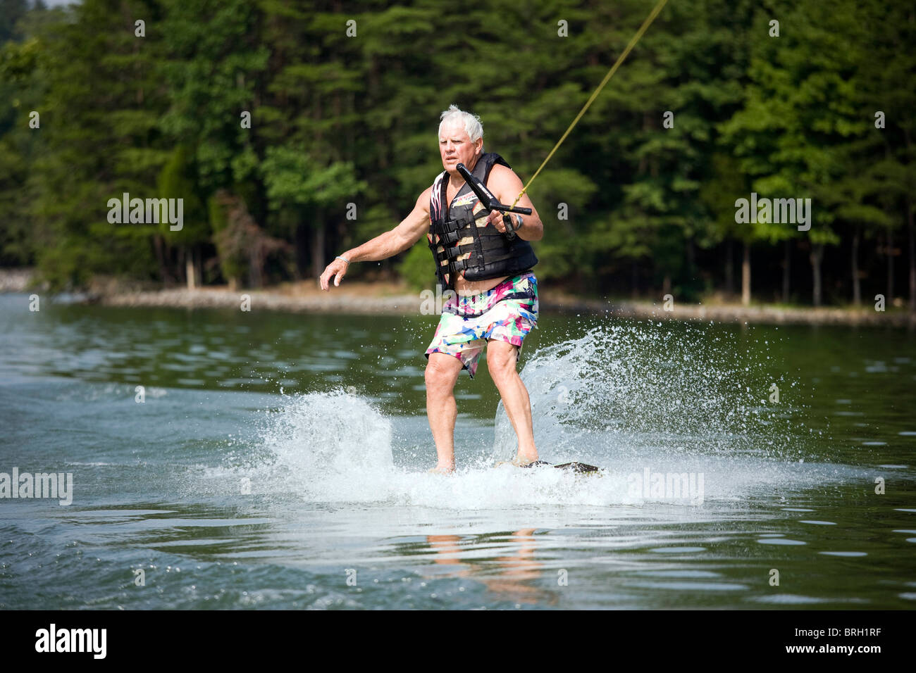 Senior citizen water skiing on a Tennessee lake. Stock Photo