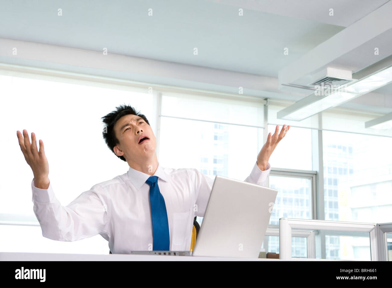 Frustrated office work at his desk Stock Photo