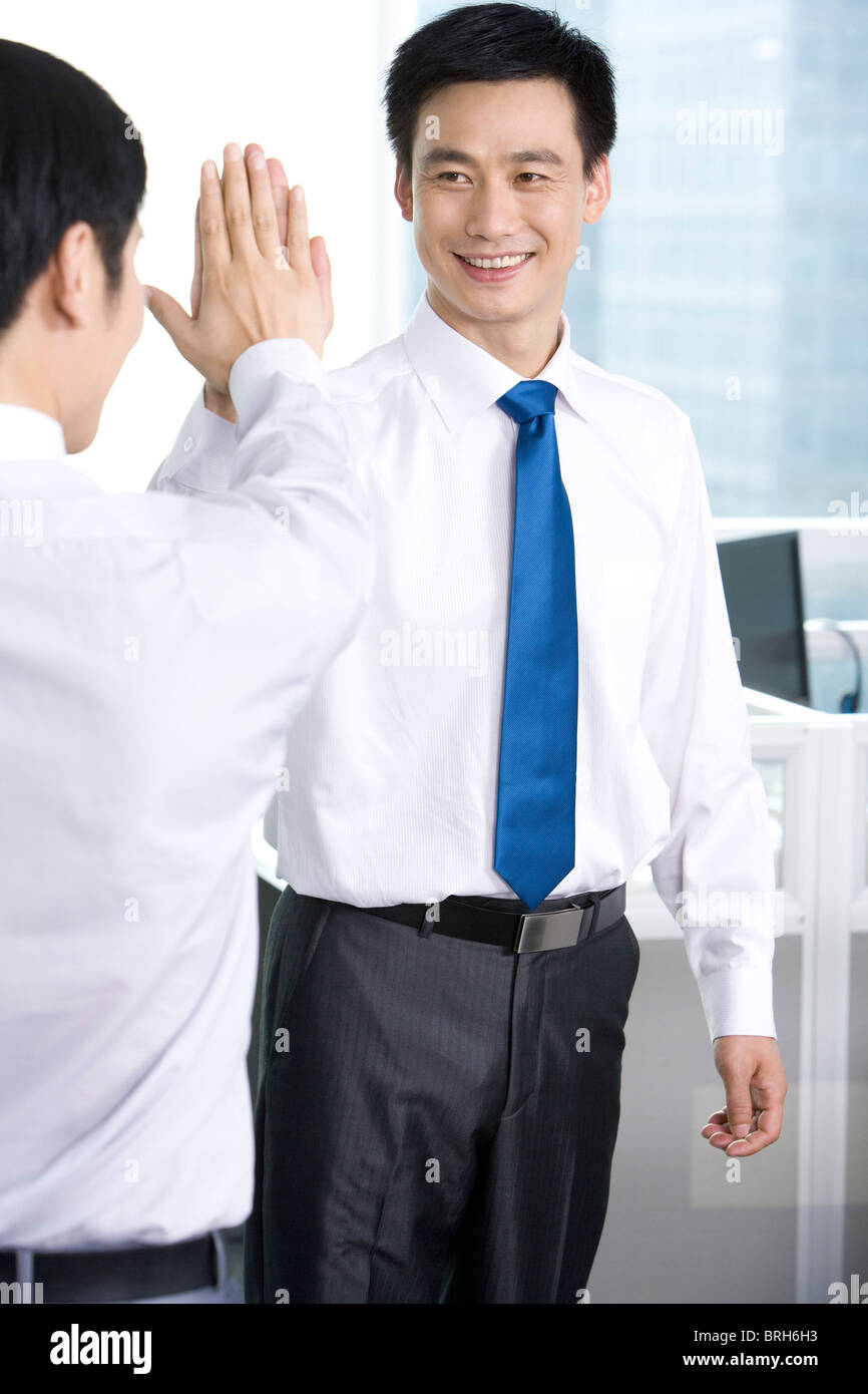 Cheering office workers Stock Photo - Alamy