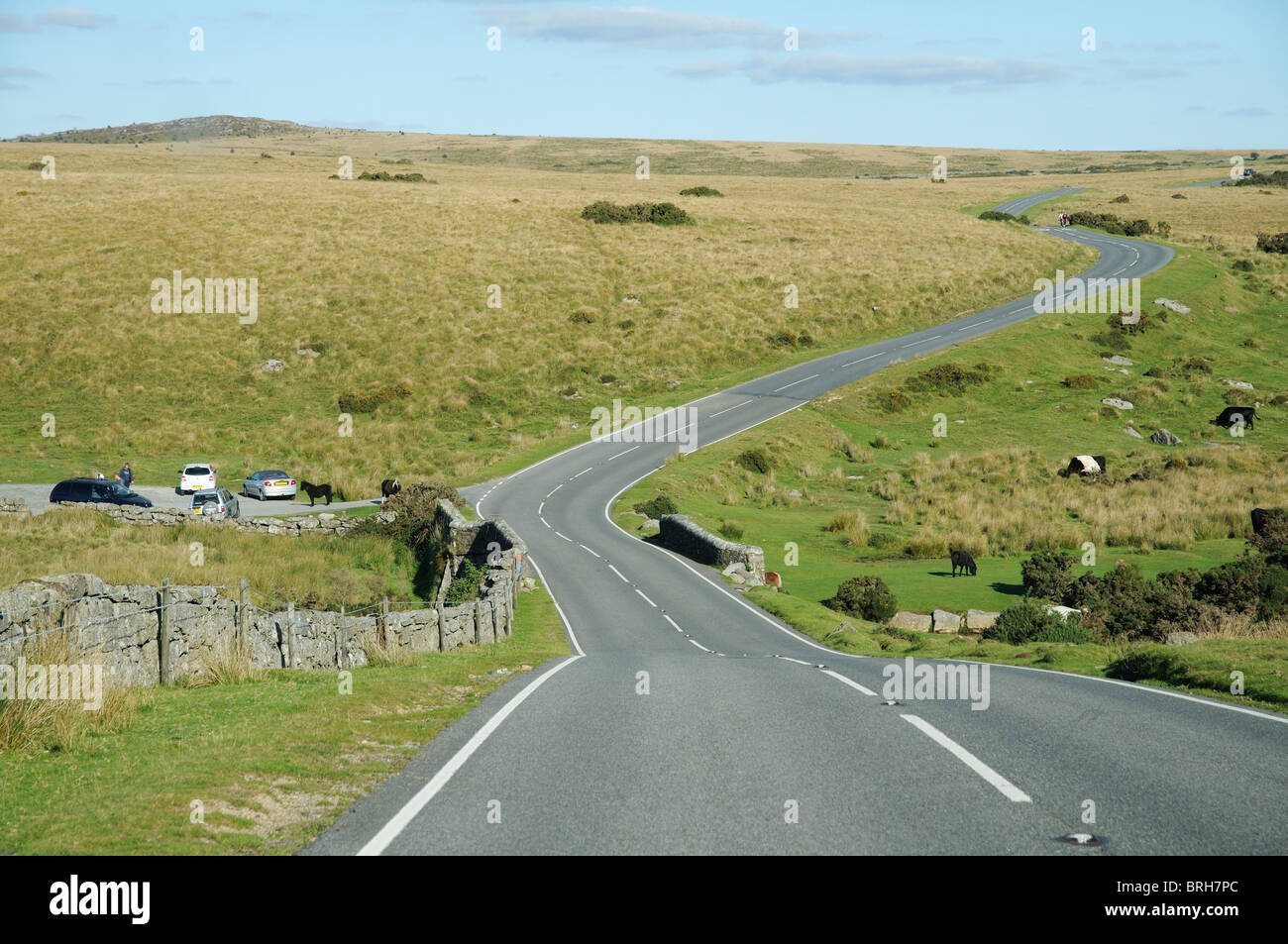 Road crossing Dartmoor National Park Devon England UK Winding highway looking toward Laughter Tor Stock Photo