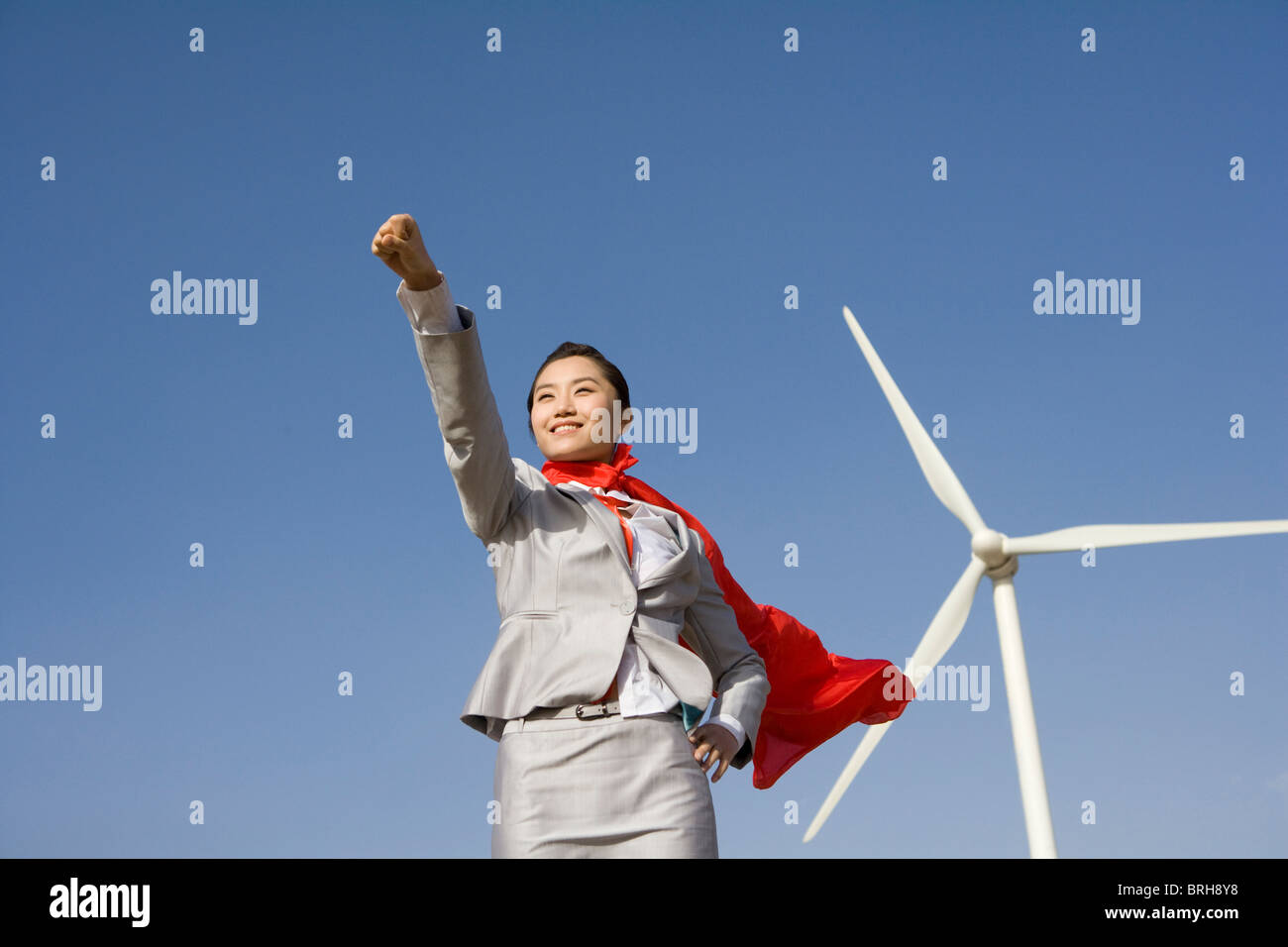 Everyday hero in front of wind turbines Stock Photo