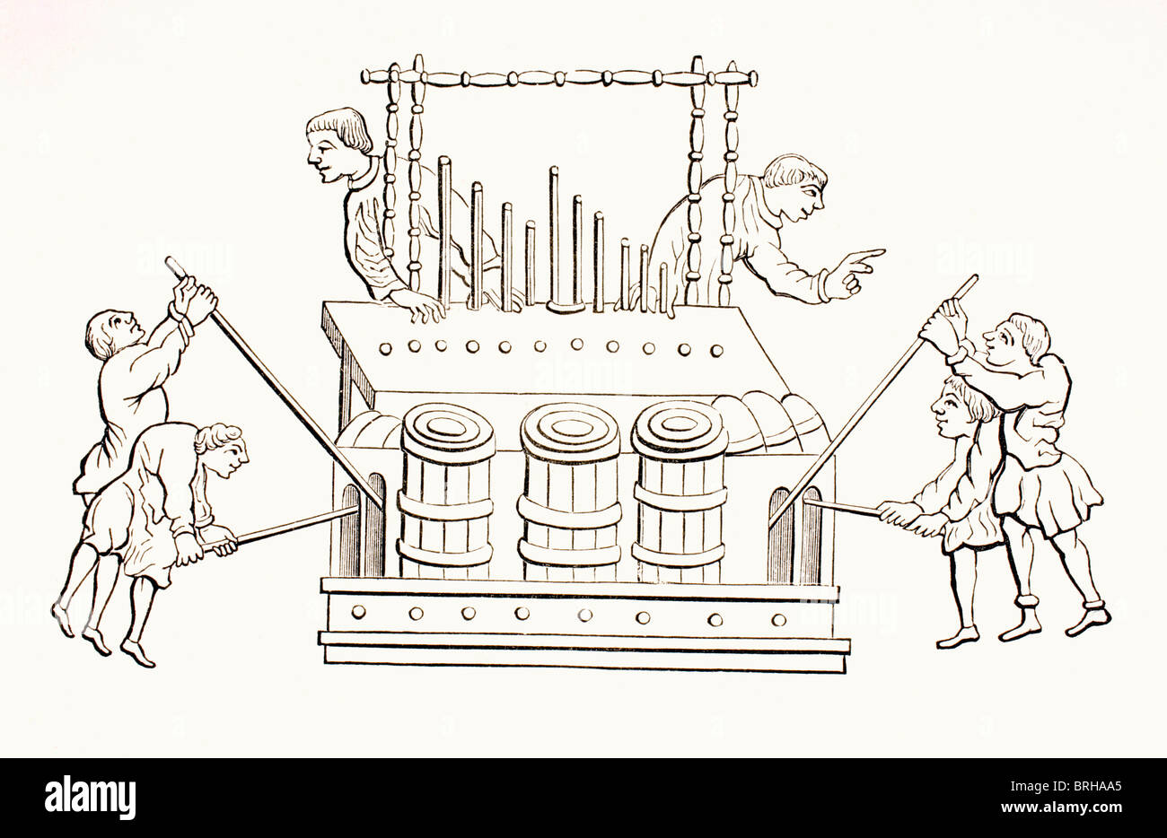 12th century bellows organ with two keyboards. Stock Photo