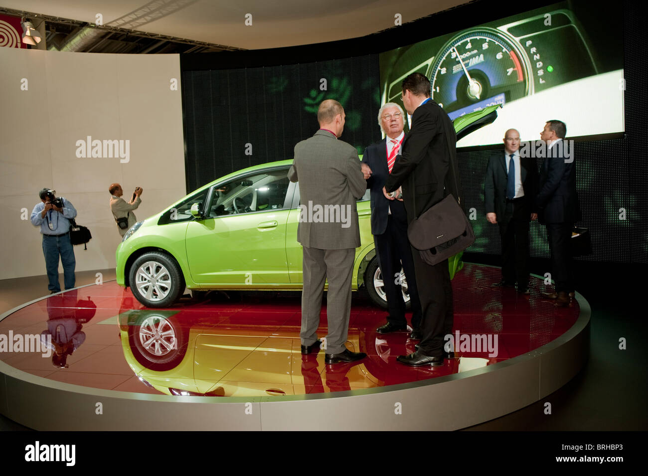Paris, France, Car Show , Group Businessmen Meeting near Electric Cars Display, 'Honda Jazz', Hybrid Engine Stock Photo