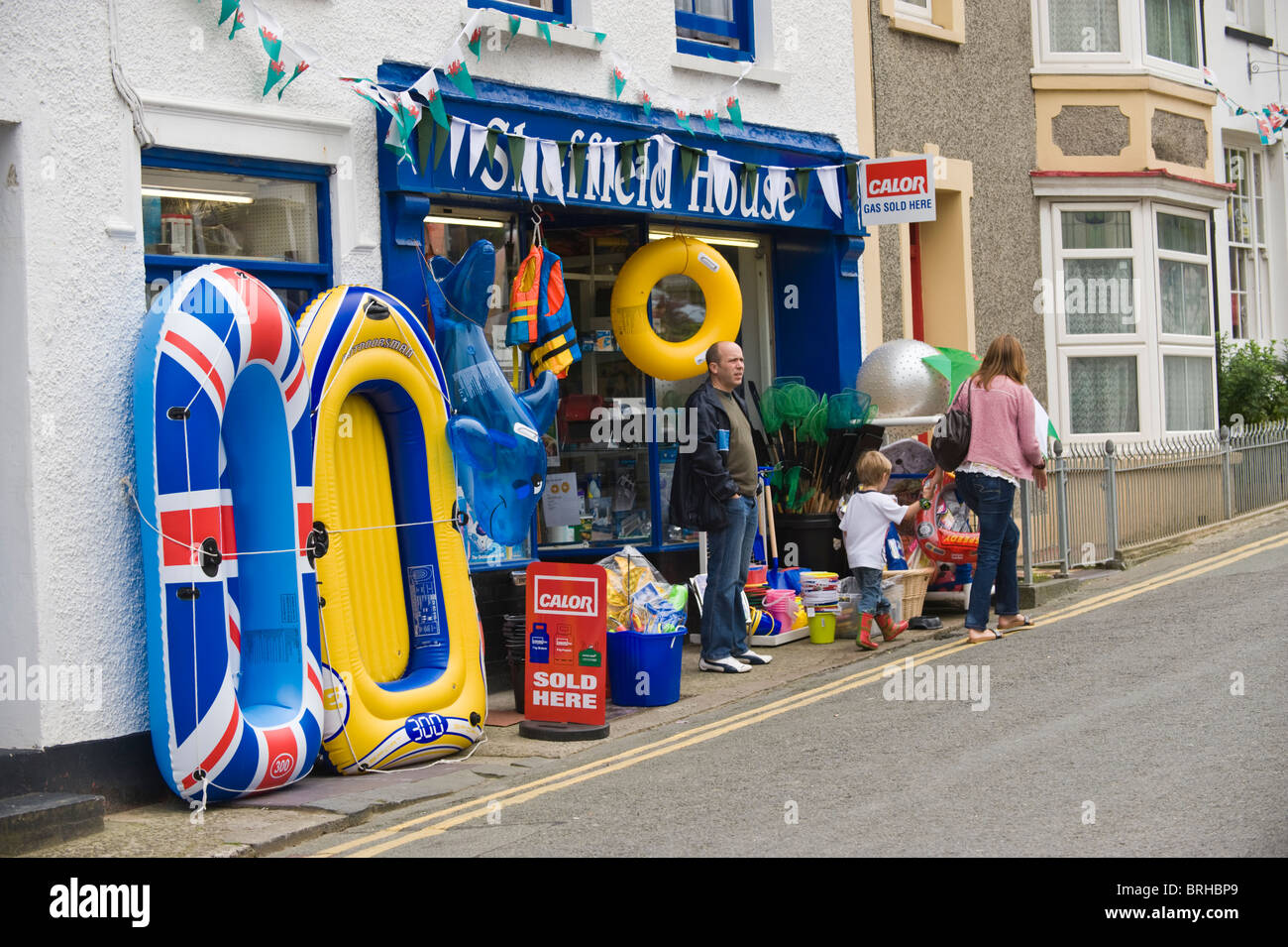 Shop selling plastic goods for holidaymakers in seaside resort of New Quay Ceredigion West Wales UK Stock Photo