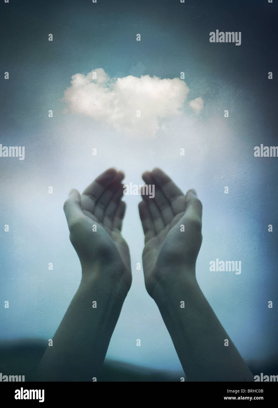hands holding a cloud Stock Photo