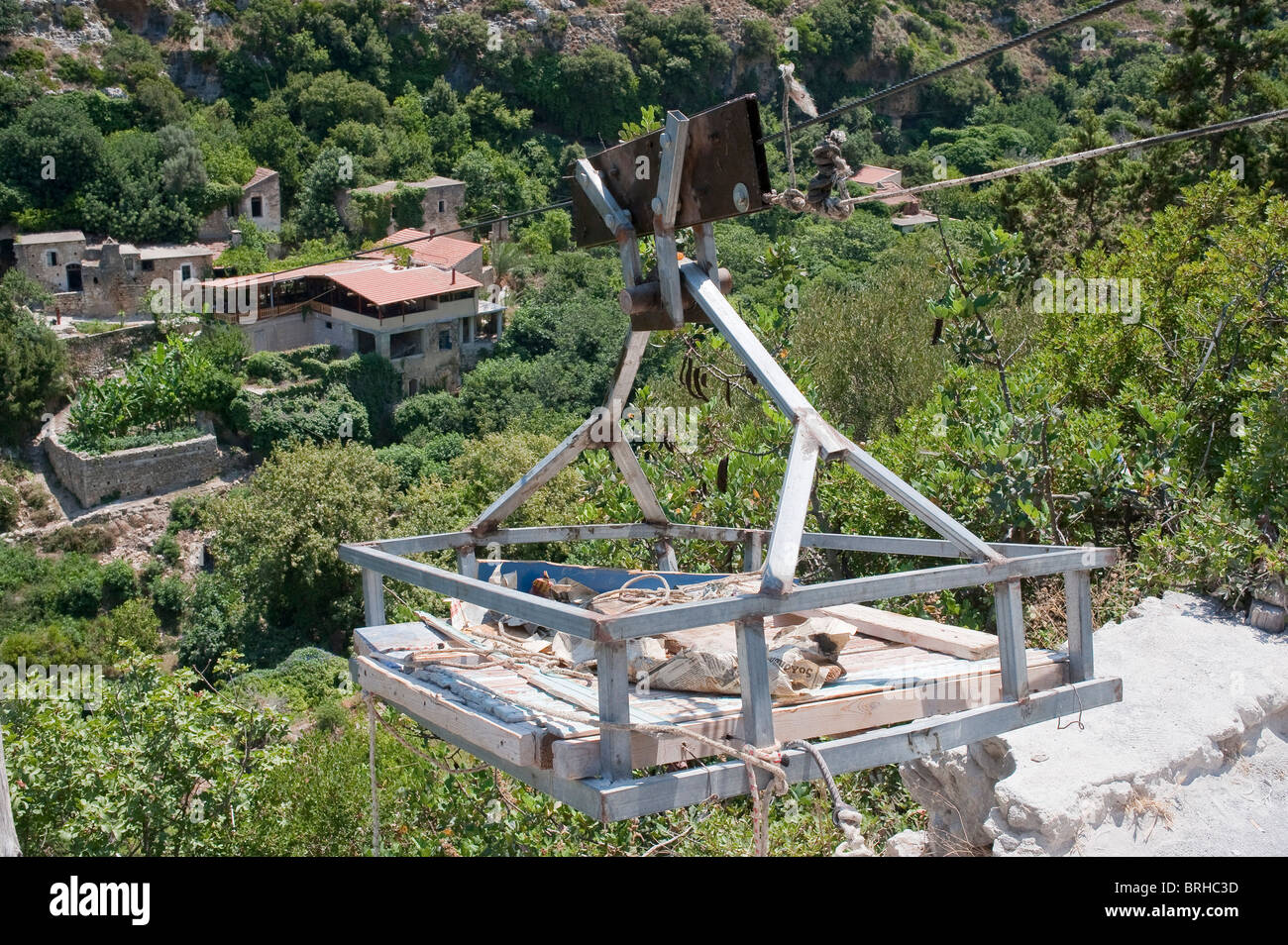 Cable lift platform to transfer good too and from the old village of Mili Crete Greece Stock Photo