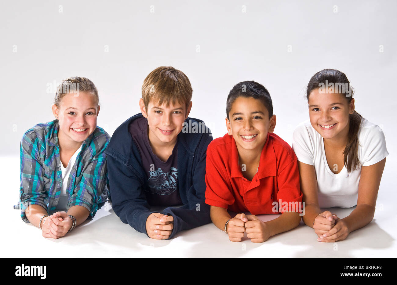 Preteen girl lying on stomach hi-res stock photography and images - Alamy