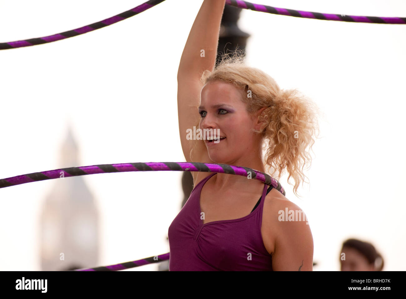 Hula Hooper Lisa Lotti performs on London's South Bank with Big Ben in the background. Stock Photo