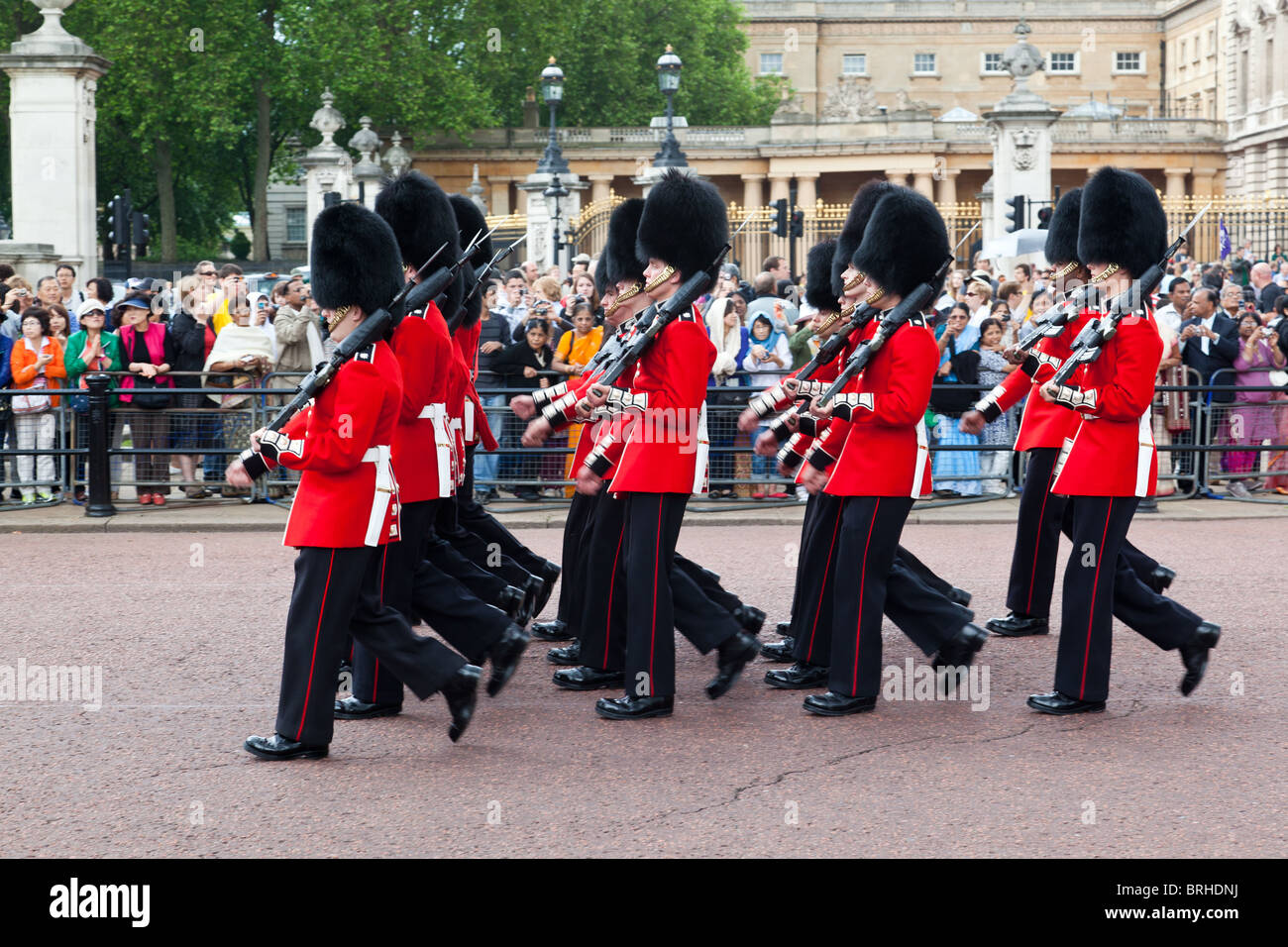 Queen's guardsmen march outside Buckingham Palace during    changing of the guard Stock Photo