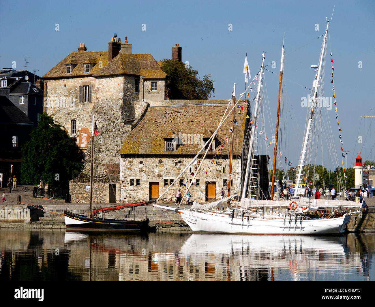 Yachts moored alongside the Lieutenance at the harbour entrance to the old port in Honfleur ,France Stock Photo
