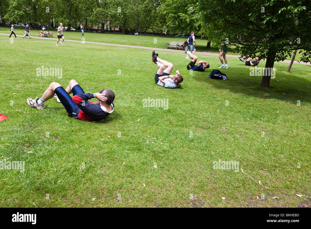 People exercising at lunchtime in St. James Park, London Stock Photo