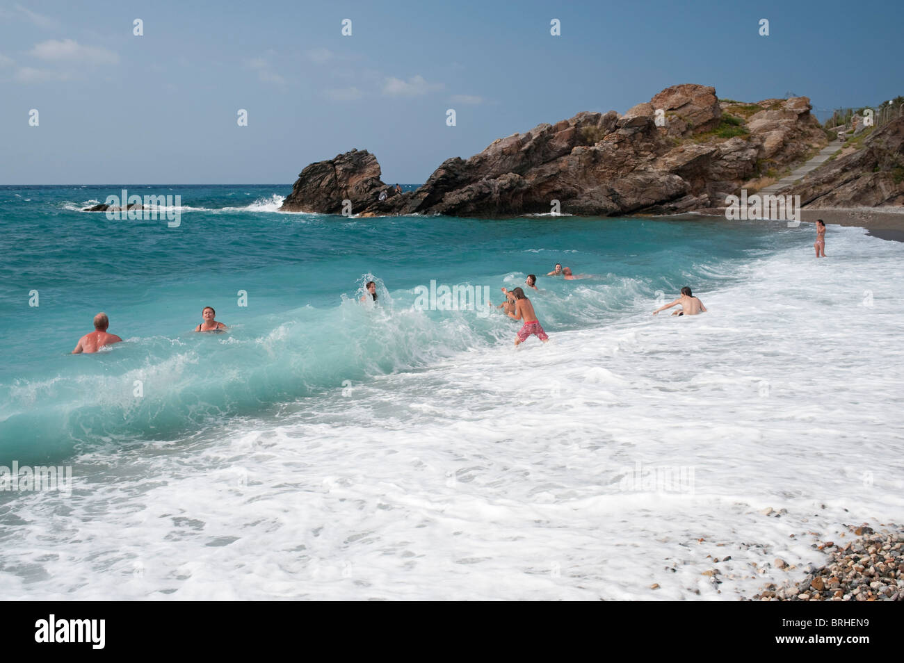 People enjoying the surf at Geropotamos beach Crete Greece Stock Photo