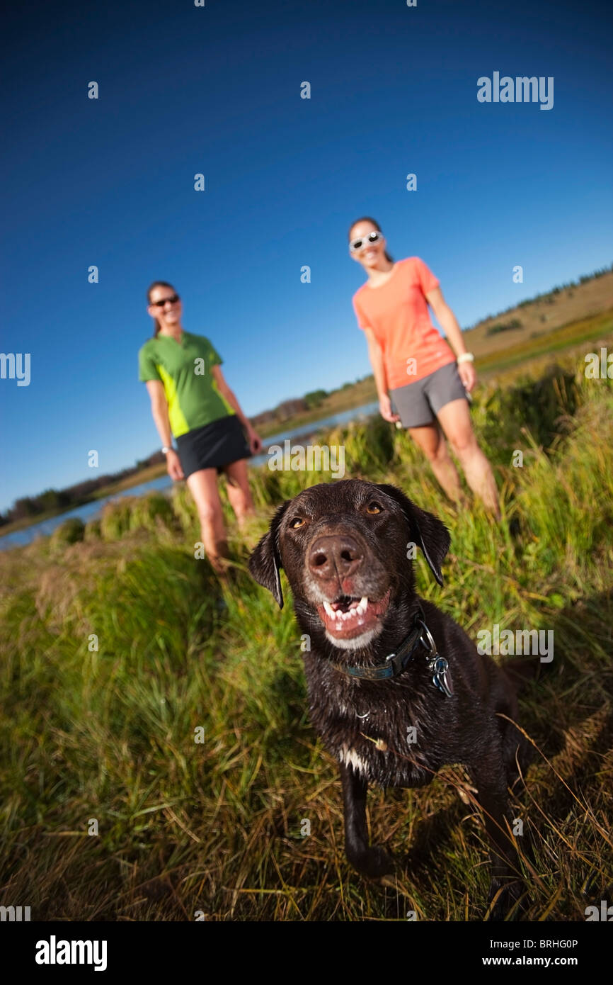 Two Women With Their Dog, Near Steamboat Springs, Colorado, USA Stock